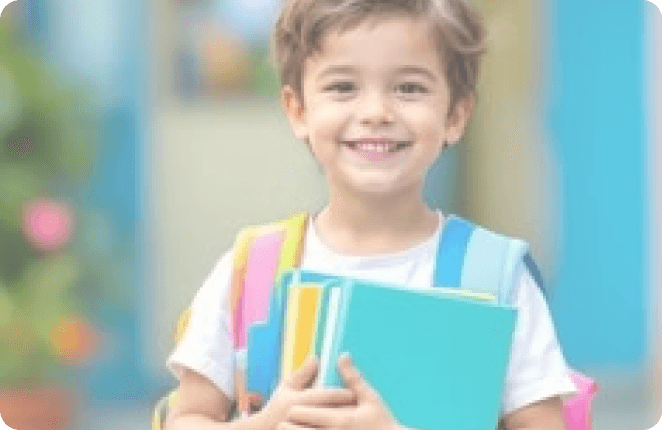 Smiling student holding books
